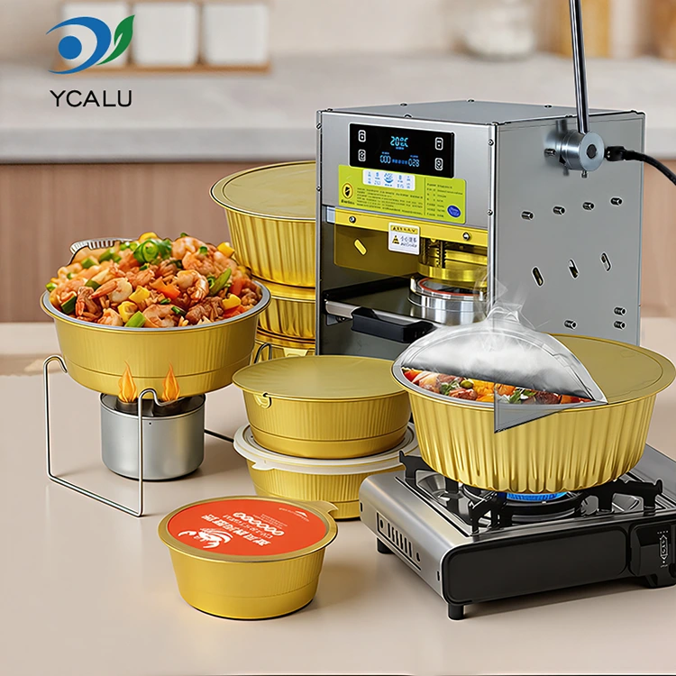 Manuelle Heißsiegelmaschine mit goldenen Aluminiumfolienbehältern